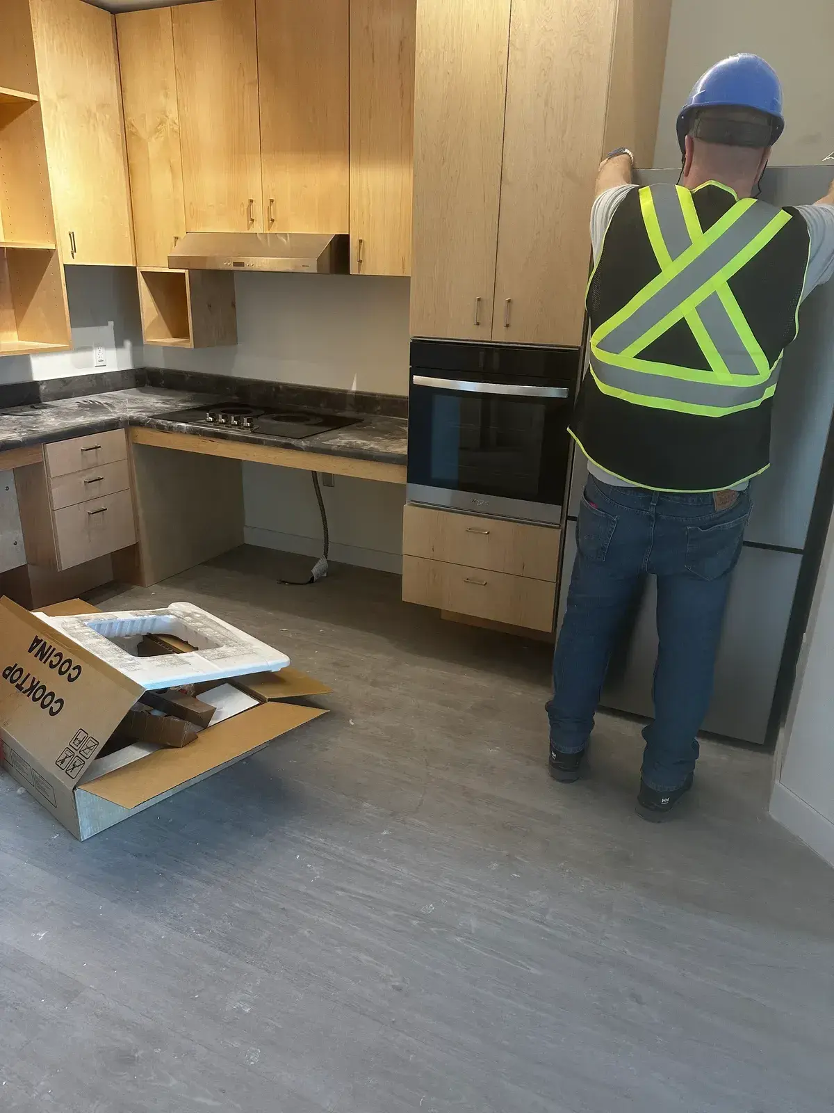 Smood Services technician fitting an appliance on site in a Greater Toronto kitchen