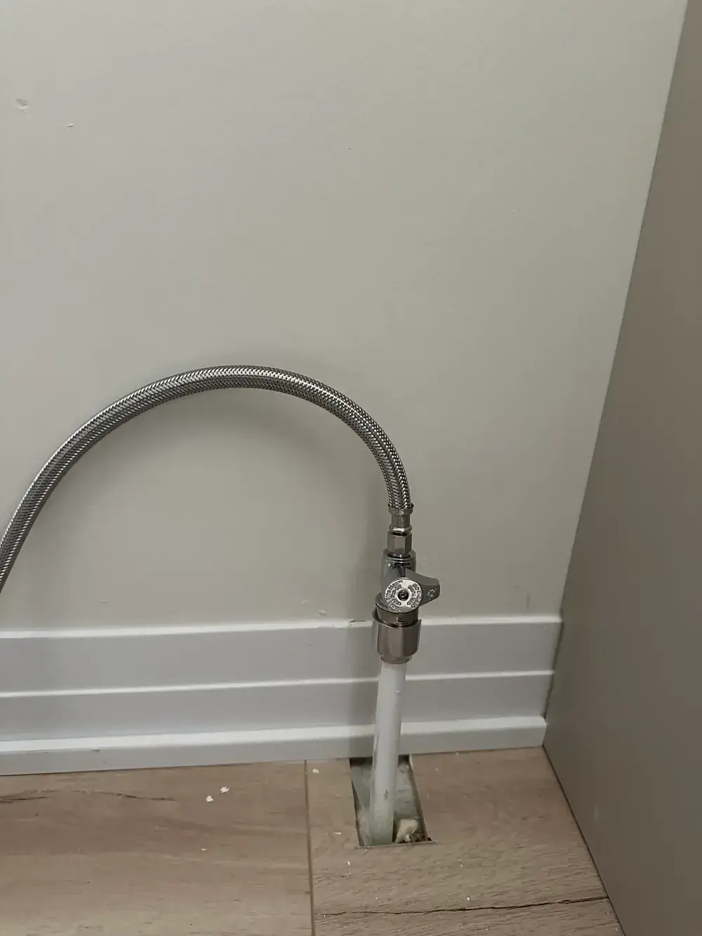 New chrome quarter-turn shut-off valve on a PEX supply line